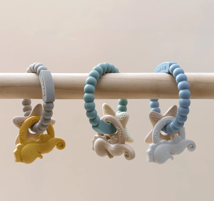 Jucărie de dentiție tip brățară – Model căluț și stea de mare, din silicon alimentar, fără BPA